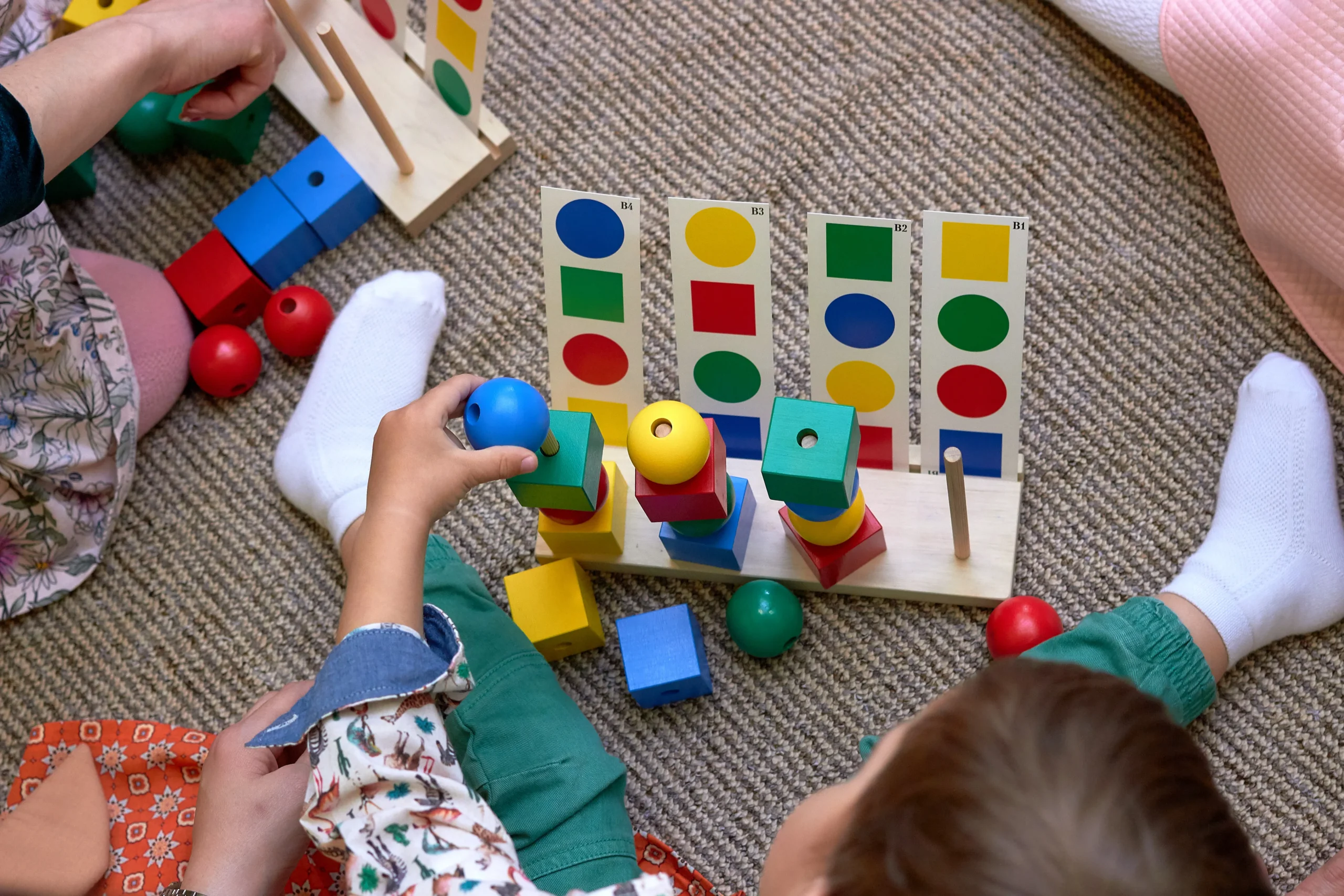 child-playing-with-colorful-wooden-shape-sorter-to-2026-01-11-08-18-10-utc - Copia