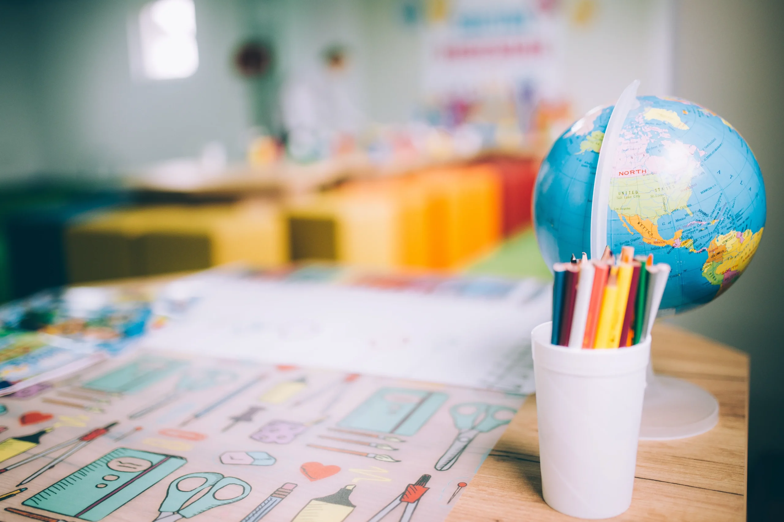 closeup-shot-of-colorful-pencils-in-a-cup-and-a-gl-2026-01-07-07-29-51-utc - Copia